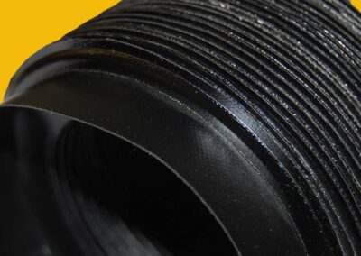 Close-up of a black welded construction circular bellows