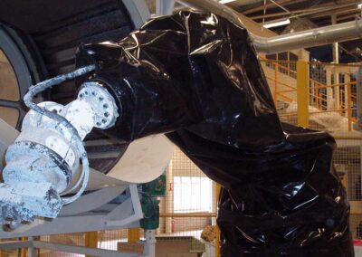 Protective cover on a ceramic moulding robot