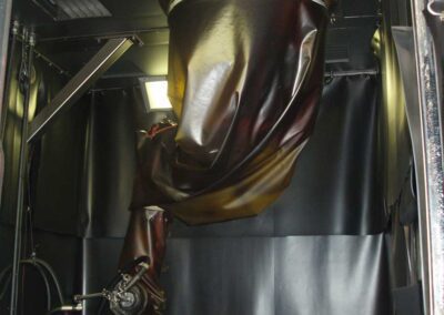 Protective cover on a shot blasting robot