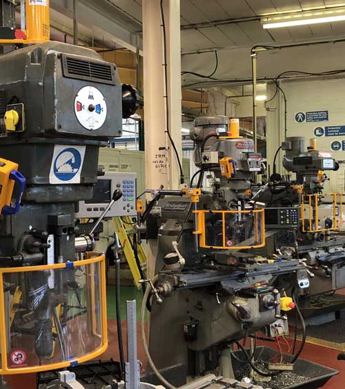 Safety guards fitted to multiple milling machines Safety guards fitted to multiple milling machines